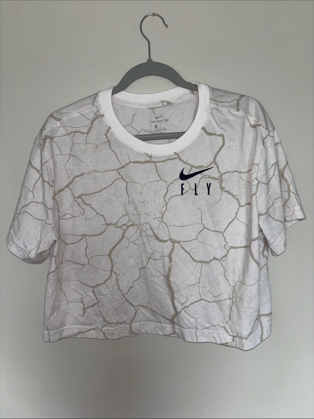Nike White Cropped Tee with Beige Crackle Design